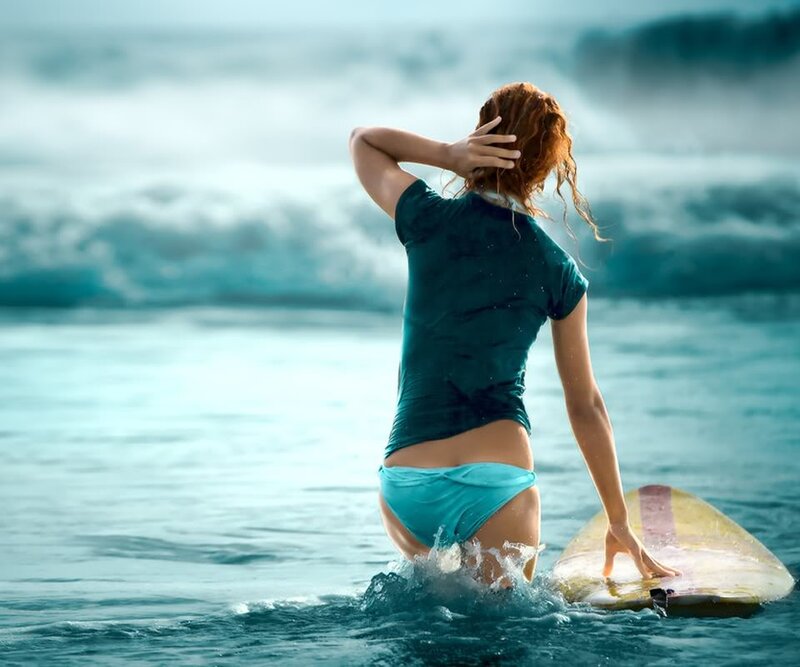 Surfer woman in ocean