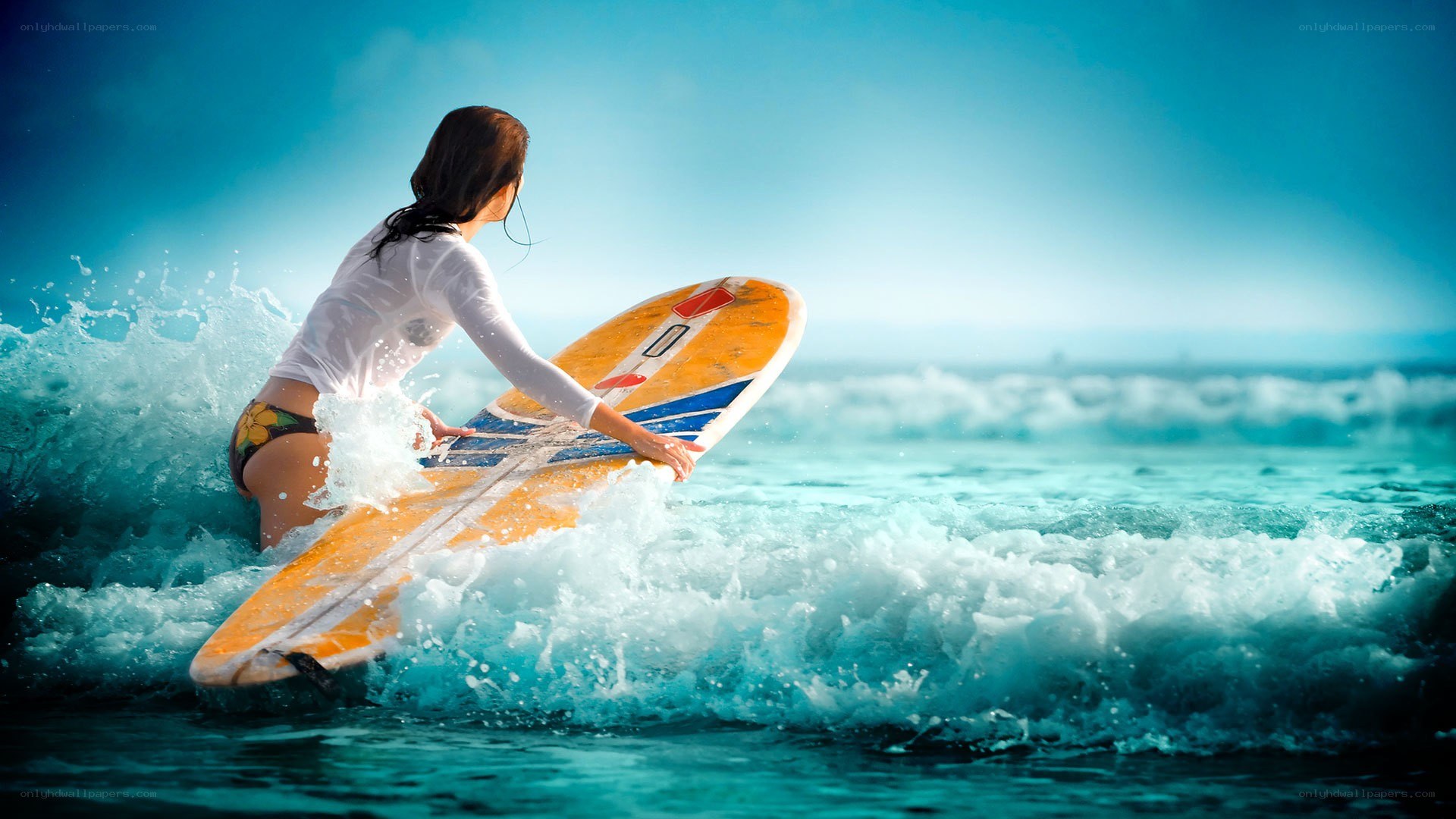 Surfer woman on wave
