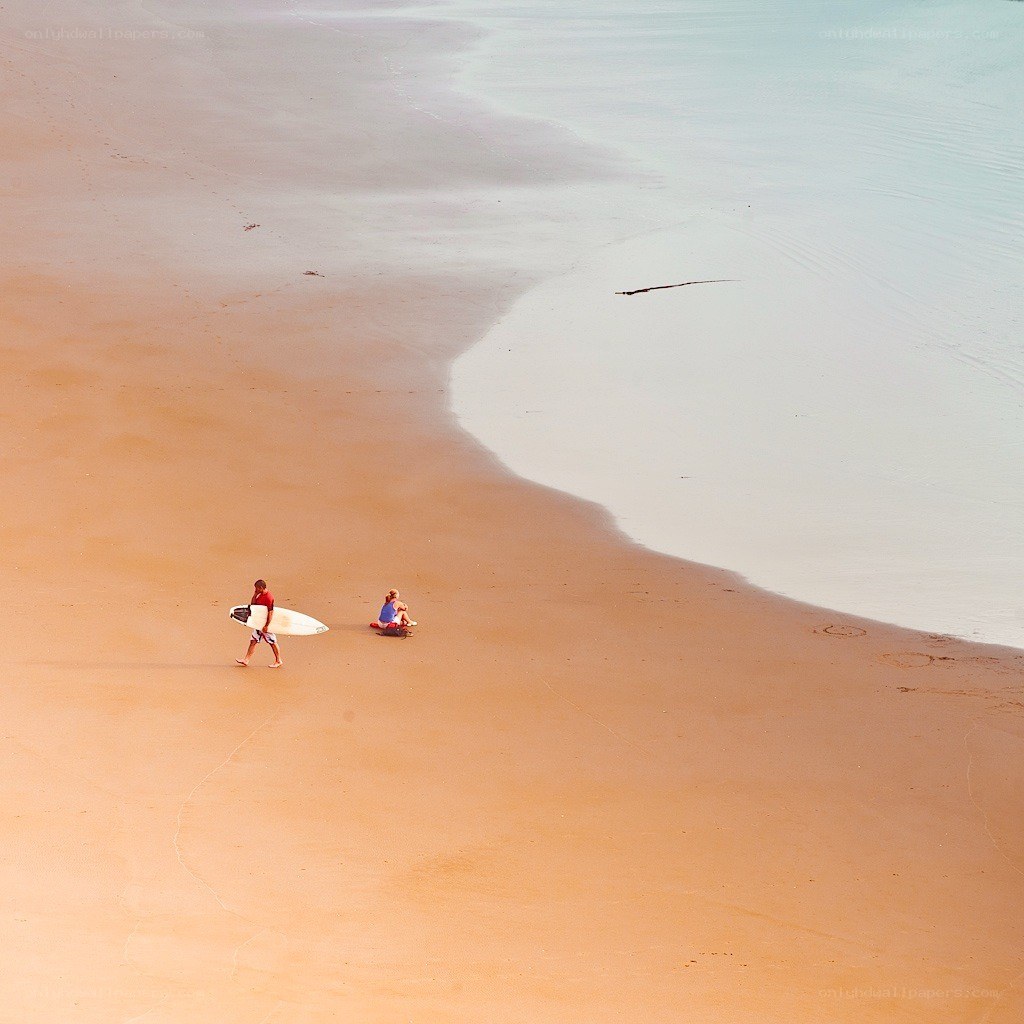 Surfers on a quiet beach