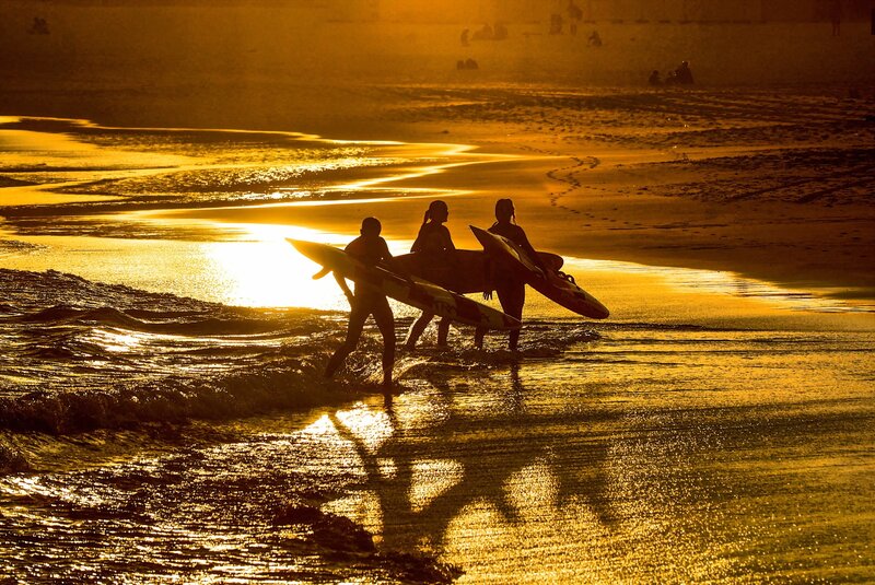 Surfers on Beach — Gold