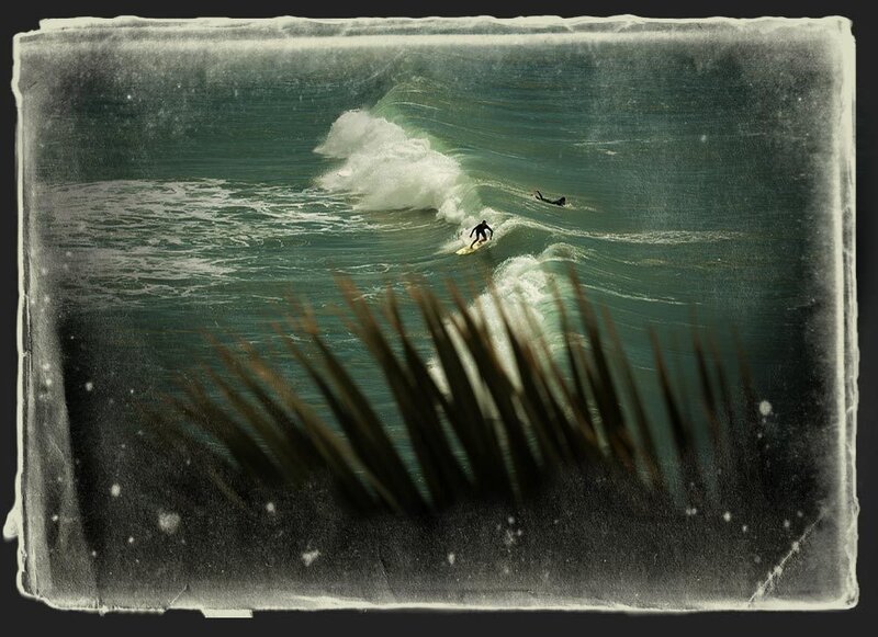 Surfers riding ocean waves