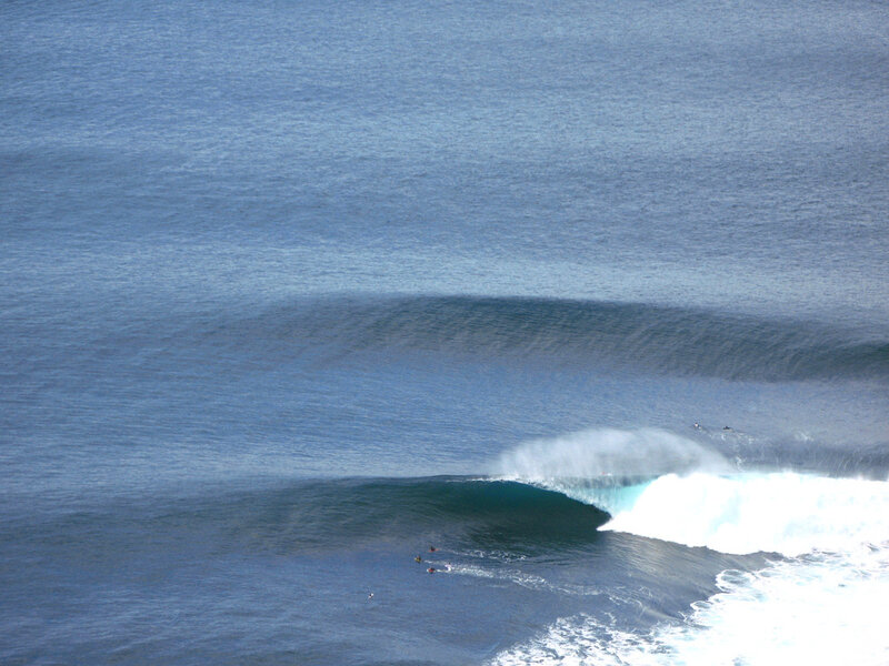 Surfers riding ocean waves