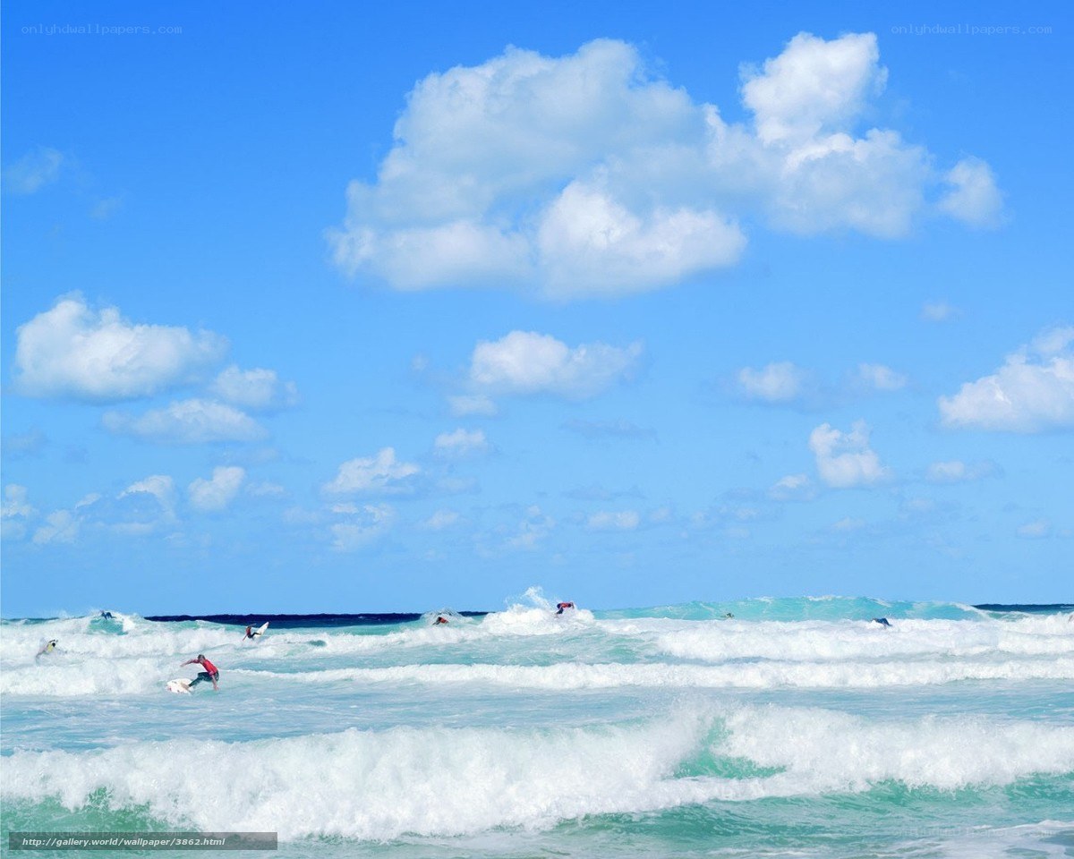 Surfers riding ocean waves