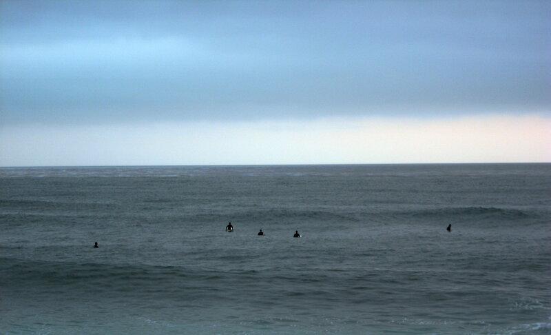surfers waiting for waves