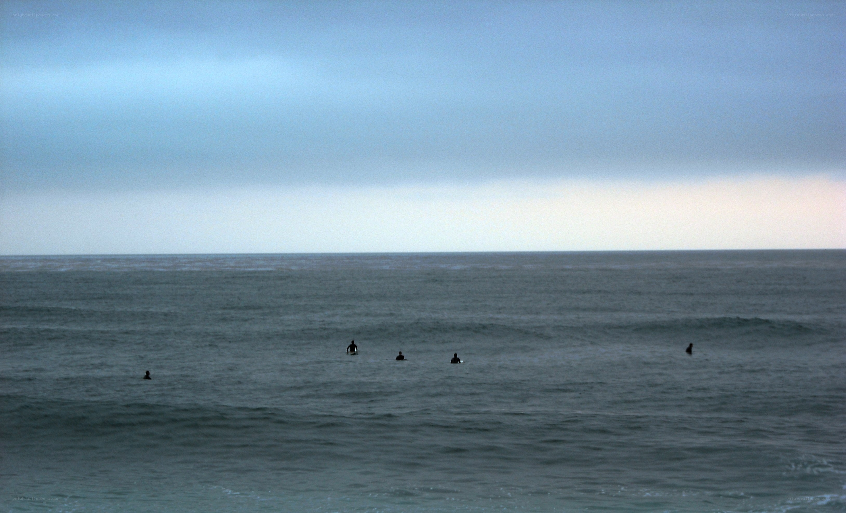 surfers waiting for waves