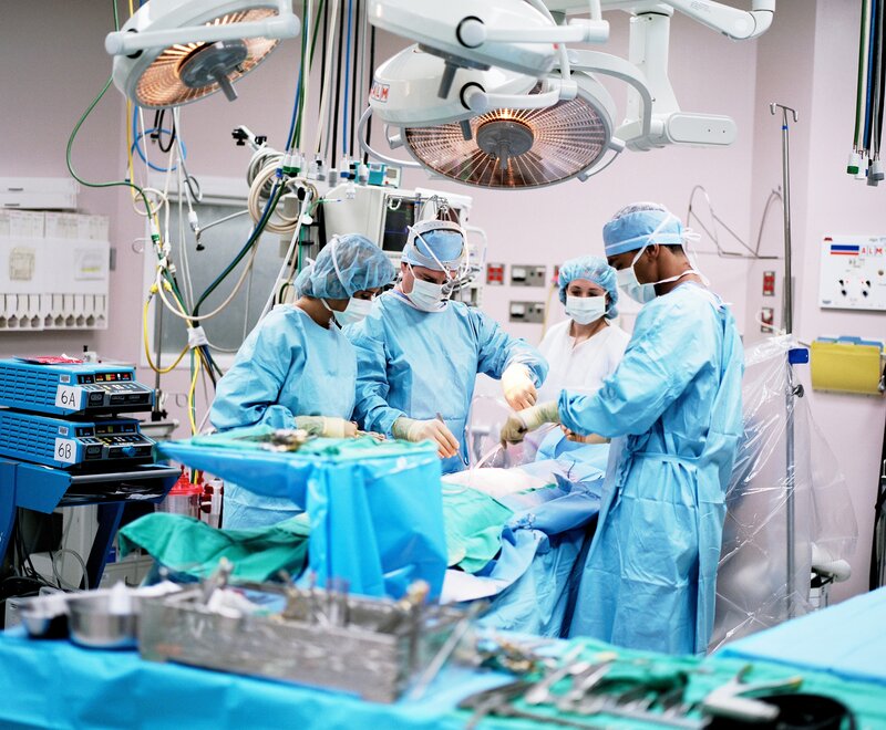 Surgeons in Operating Room — Blue, Focused