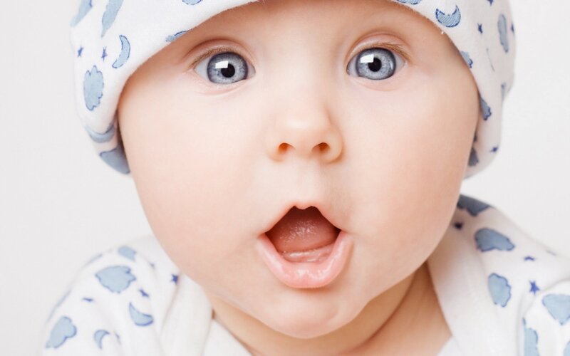 surprised baby in hat