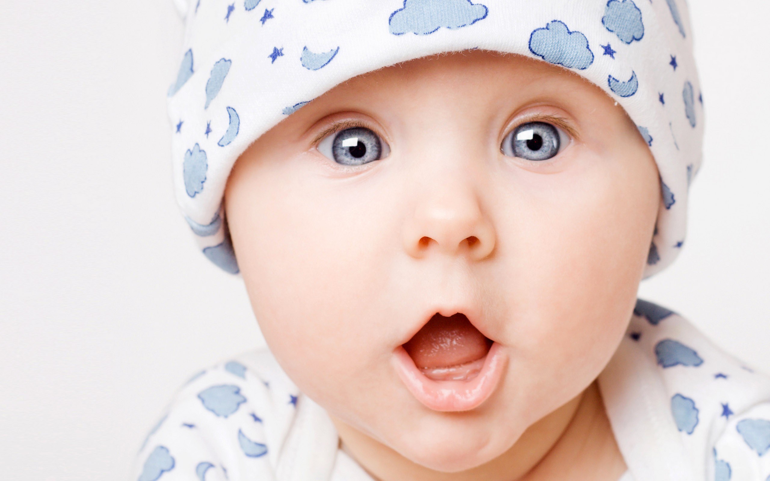 surprised baby in hat