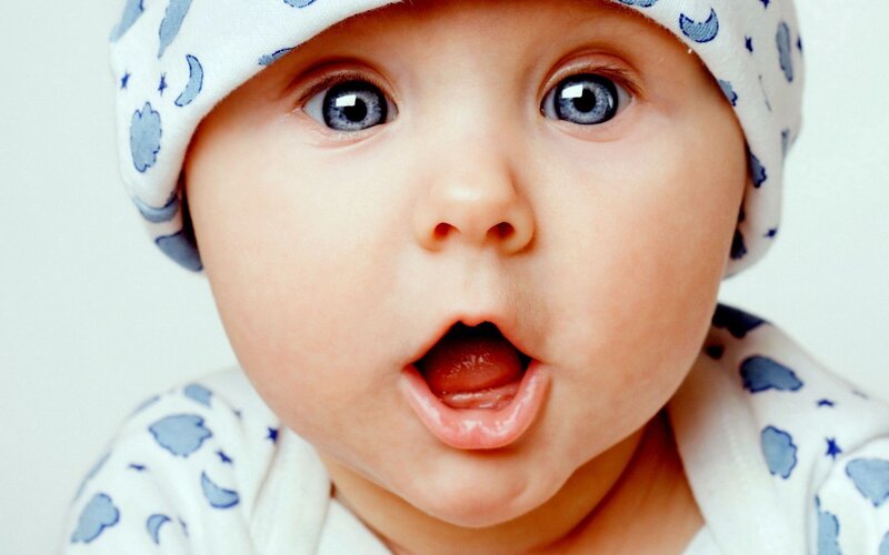 surprised baby with blue eyes