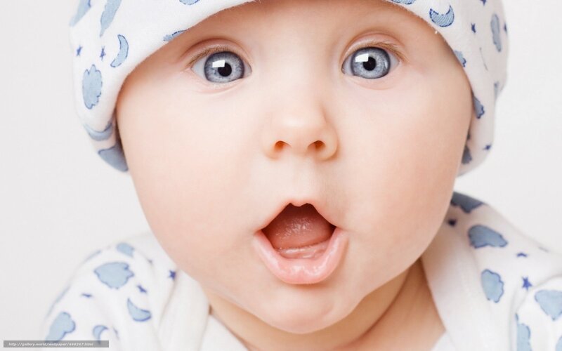 surprised baby with blue eyes