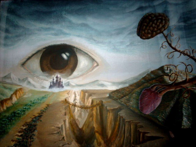 Surreal landscape with giant eye