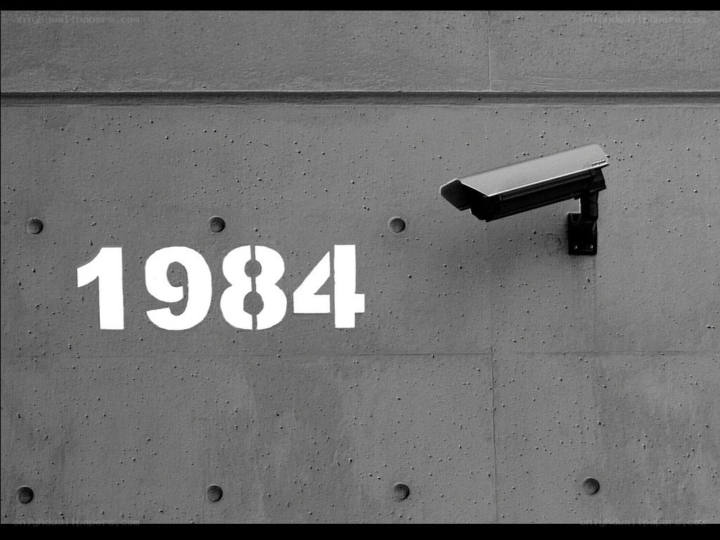 Surveillance camera on concrete wall