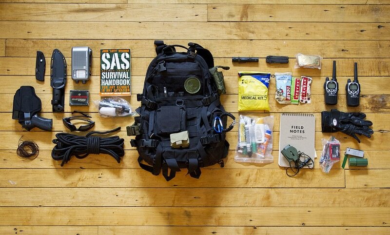 Survival gear laid out on floor