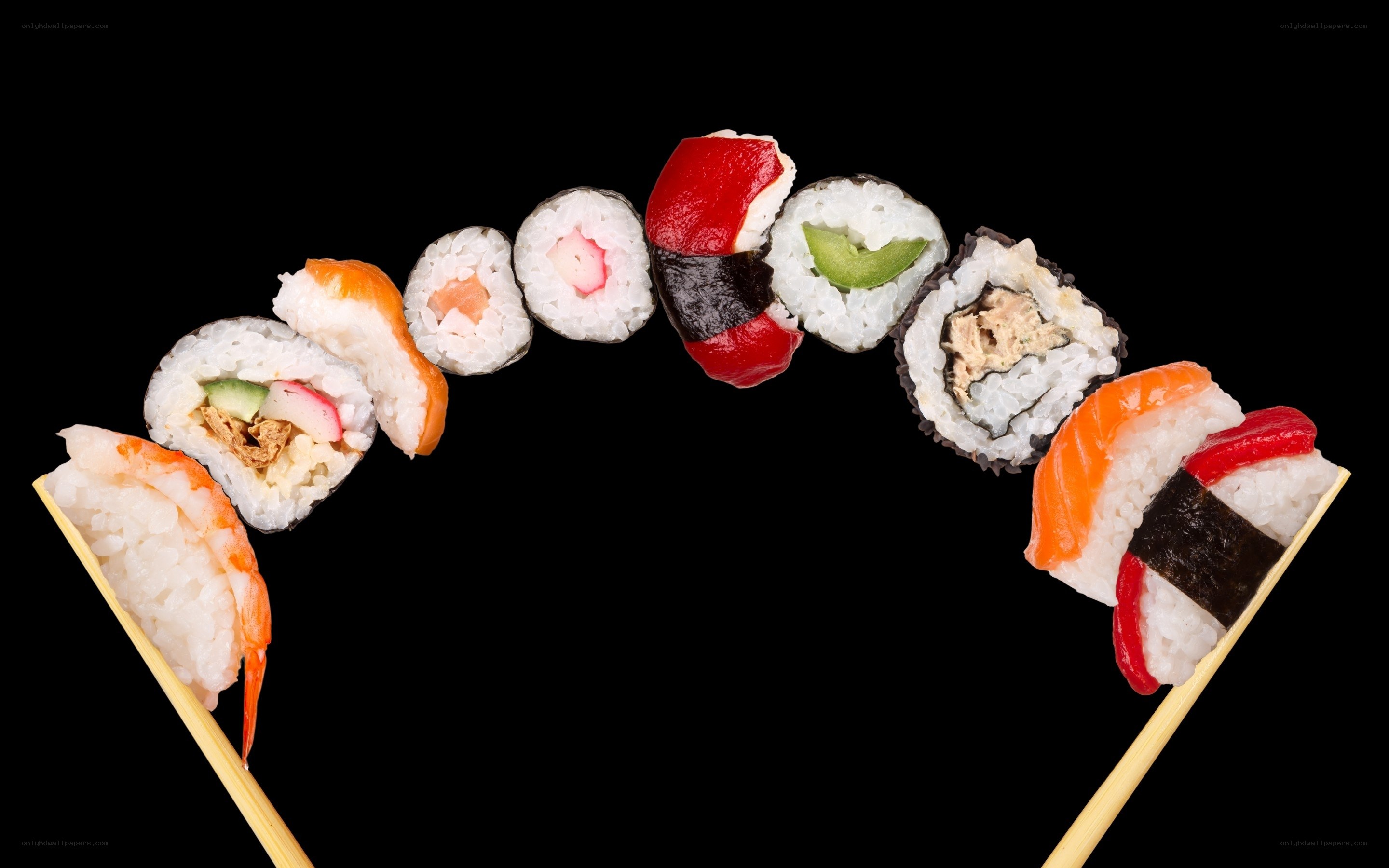 sushi assortment on chopsticks