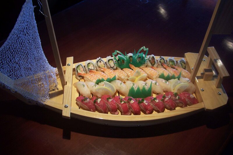 sushi boat with assorted rolls