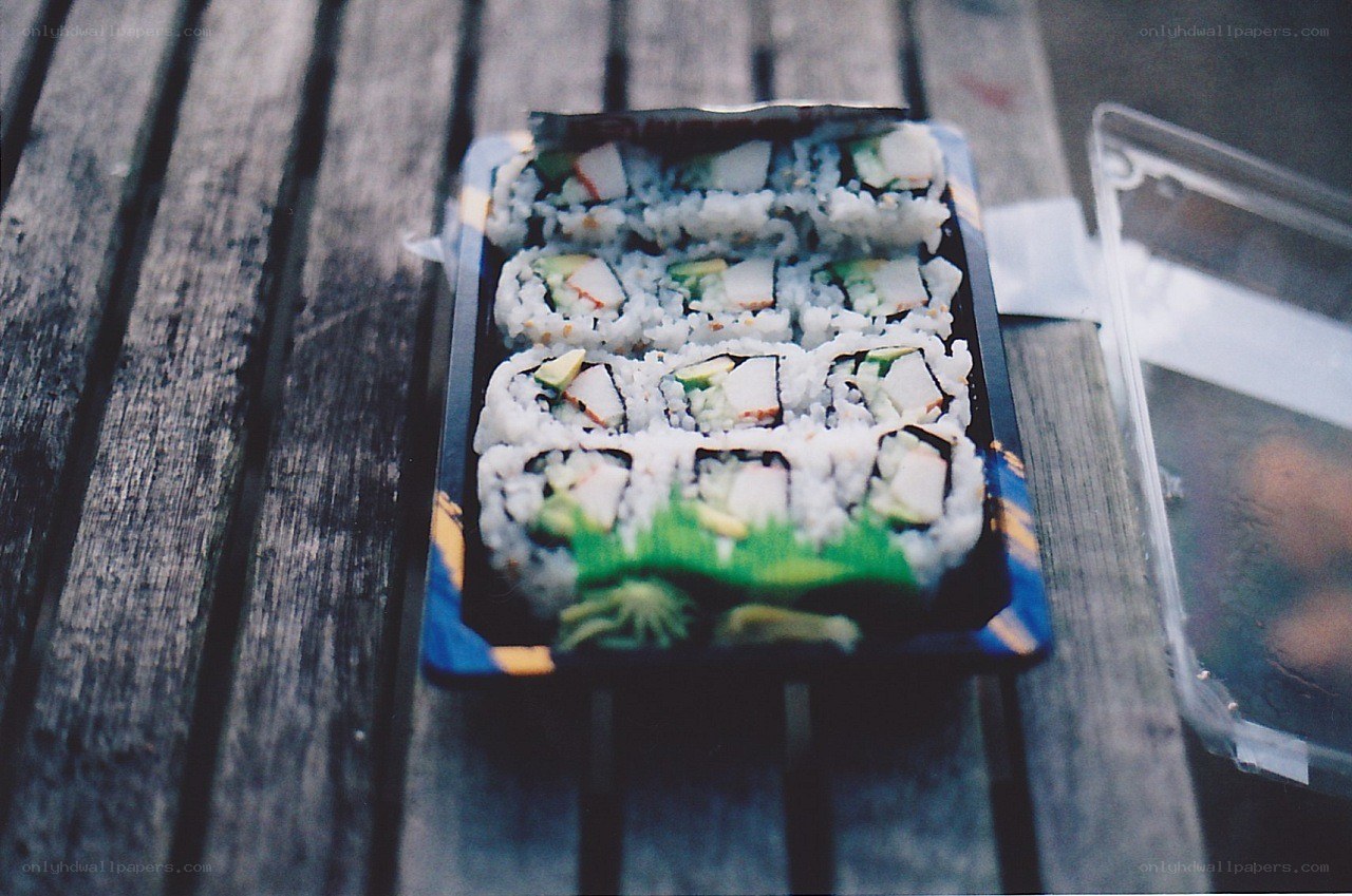 Sushi container on wooden table