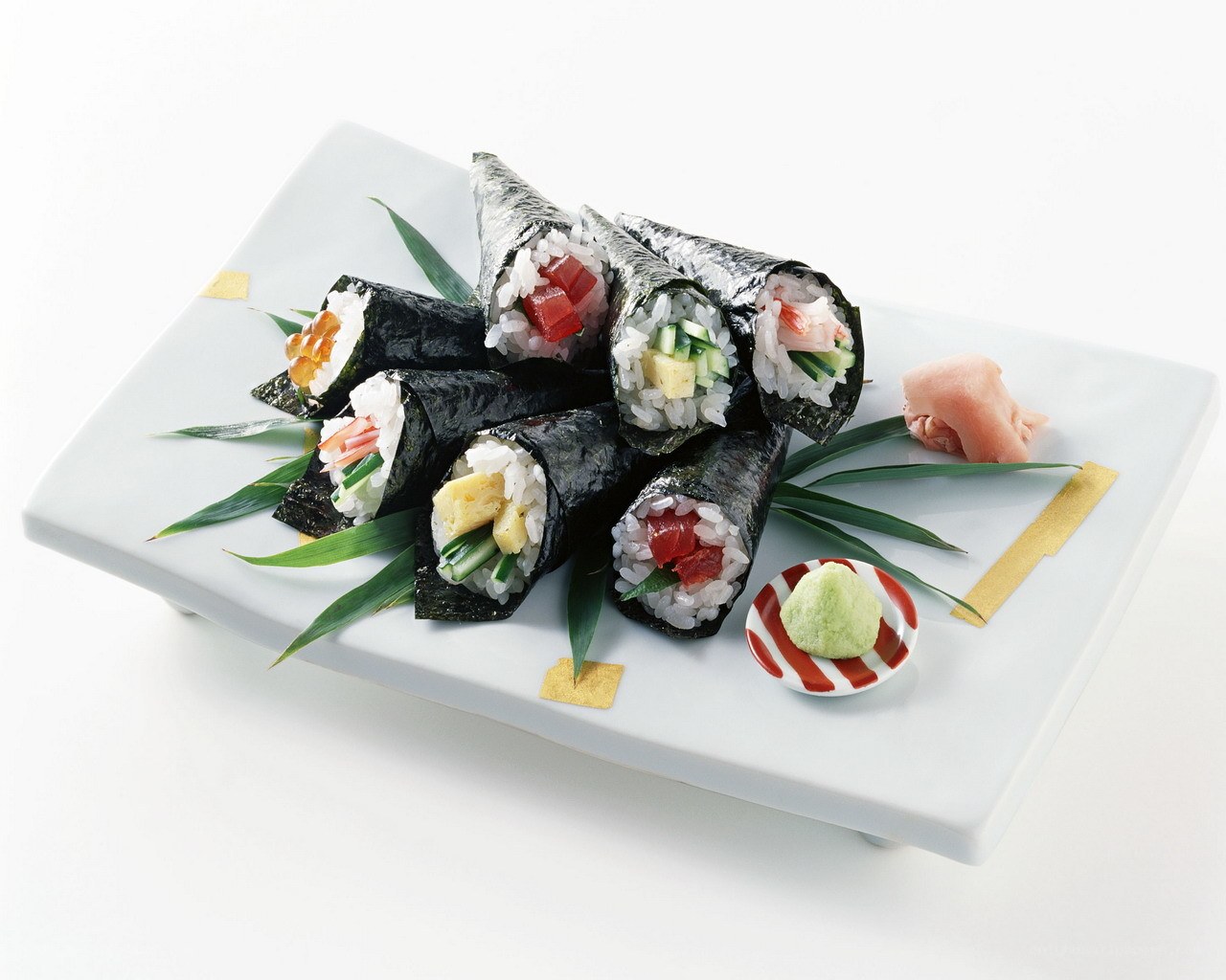 sushi hand rolls on plate