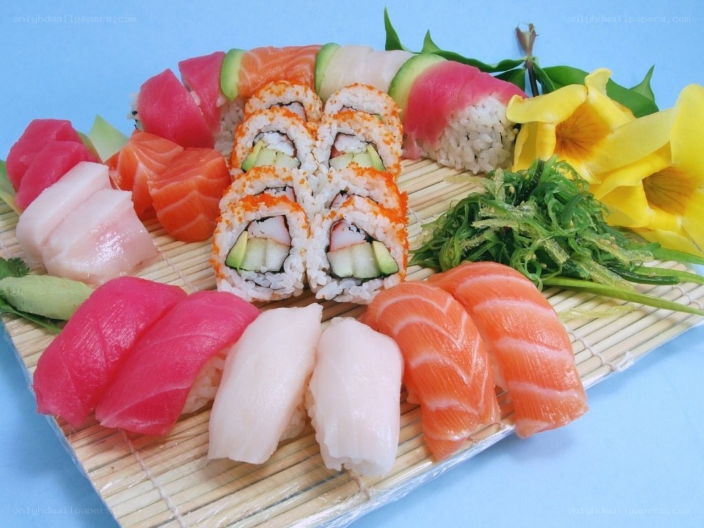 sushi platter with assorted rolls and sashimi