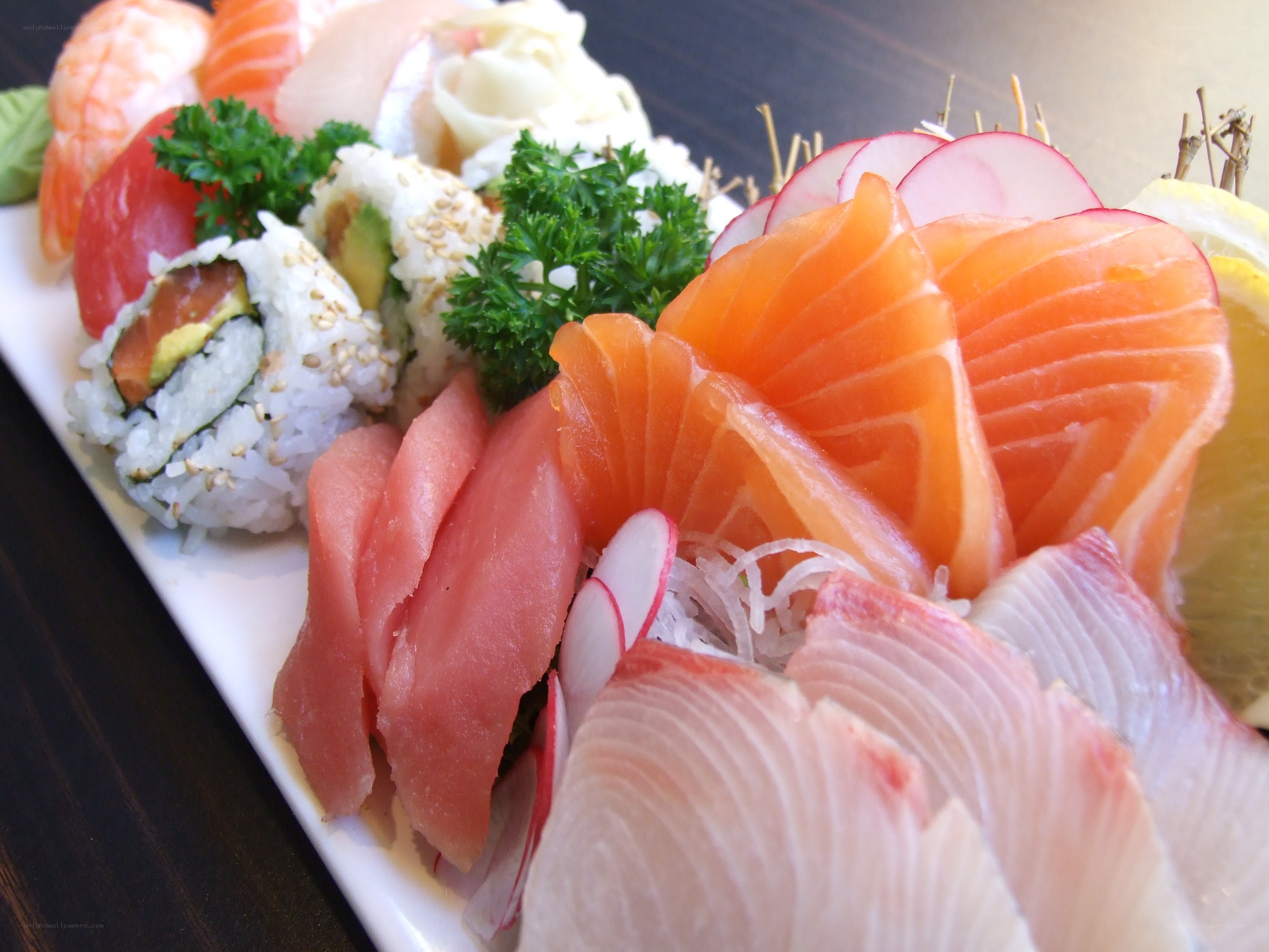 sushi platter with sashimi and rolls