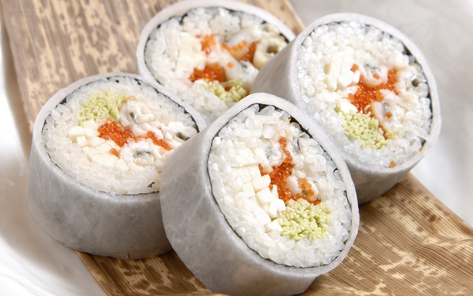 sushi rolls on bamboo mat