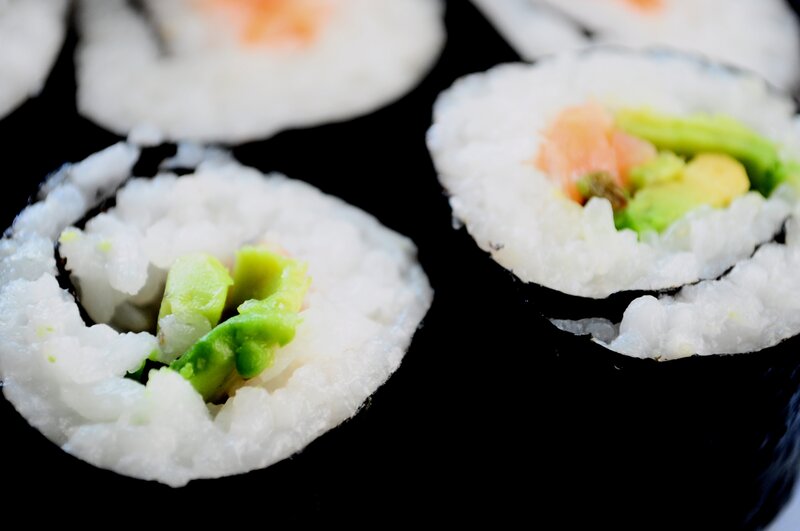 Sushi Rolls on Black Surface