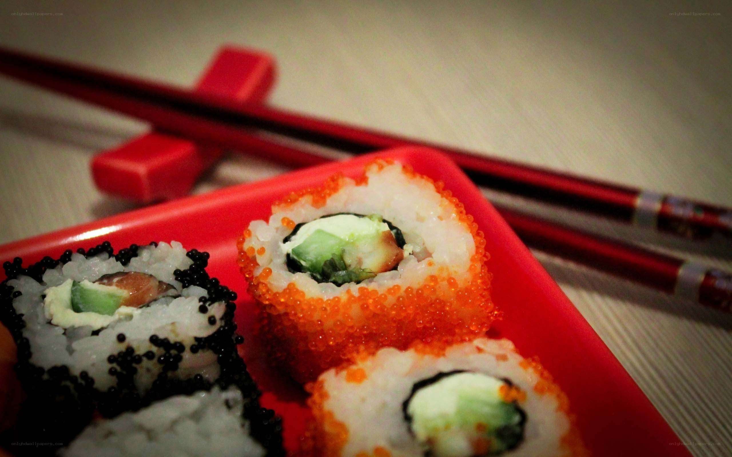 sushi rolls on red plate