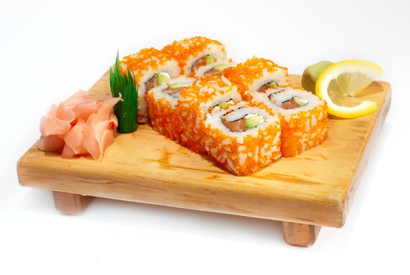sushi rolls on wooden board
