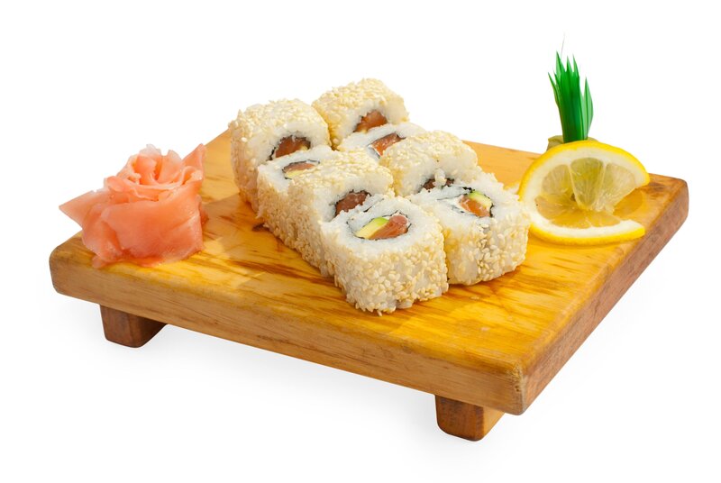sushi rolls on wooden board