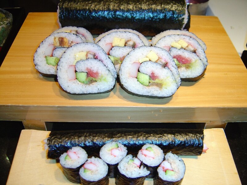 Sushi rolls on wooden platters