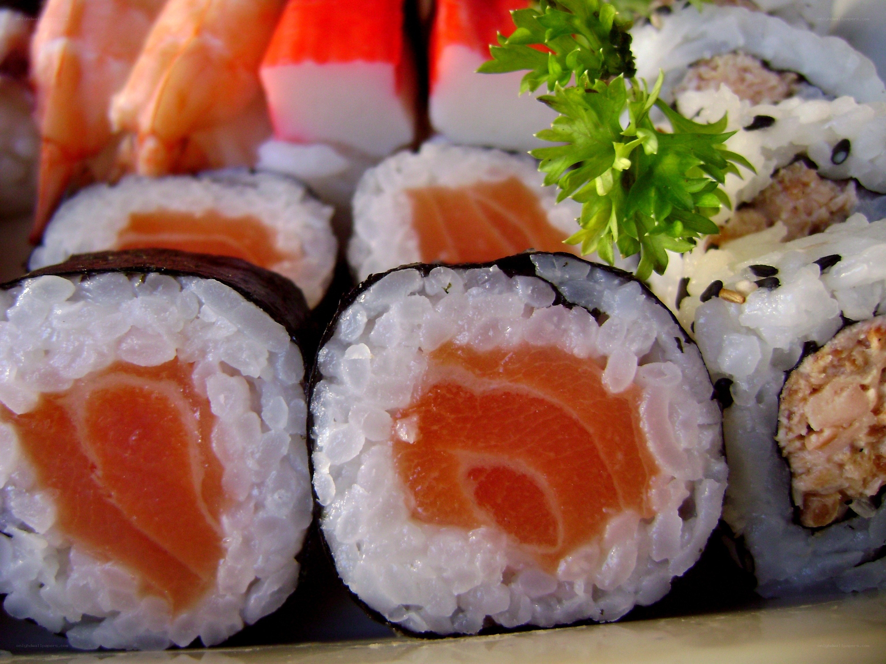sushi rolls with salmon and garnish