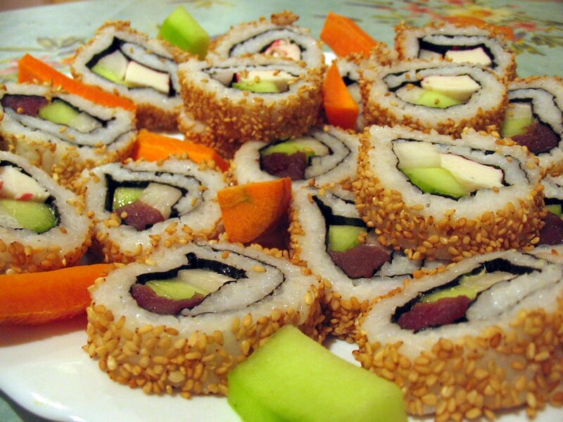 Sushi rolls with sesame seeds
