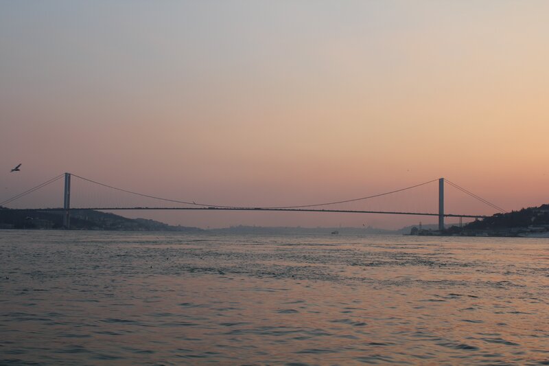 Suspension Bridge at Dusk — Orange, Serene, Sunset, Photograph, Water