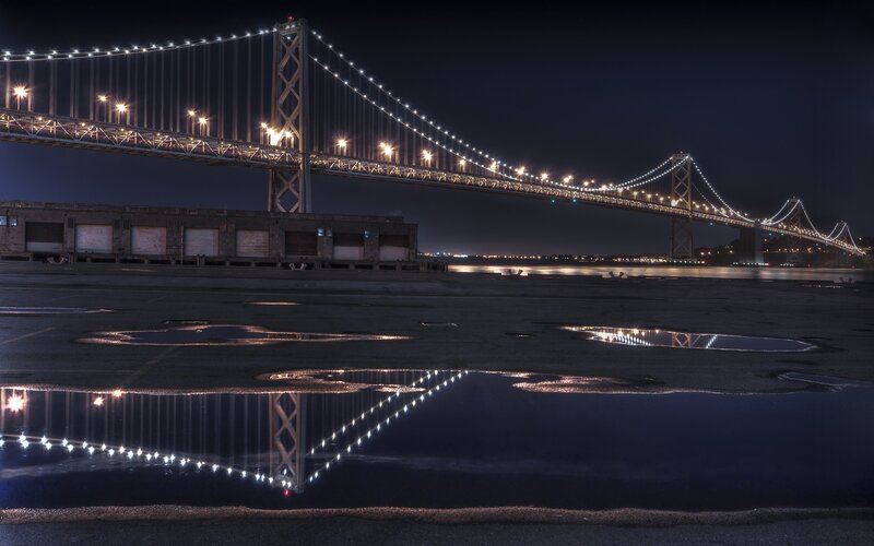 Suspension Bridge at Night — Black, Dramatic, Photograph, Puddles, Building
