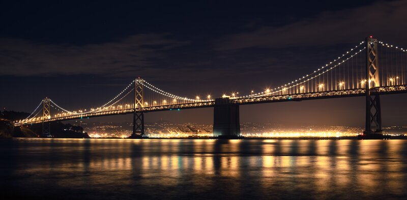Suspension Bridge at Night — Black, Serene, Photograph, City Lights