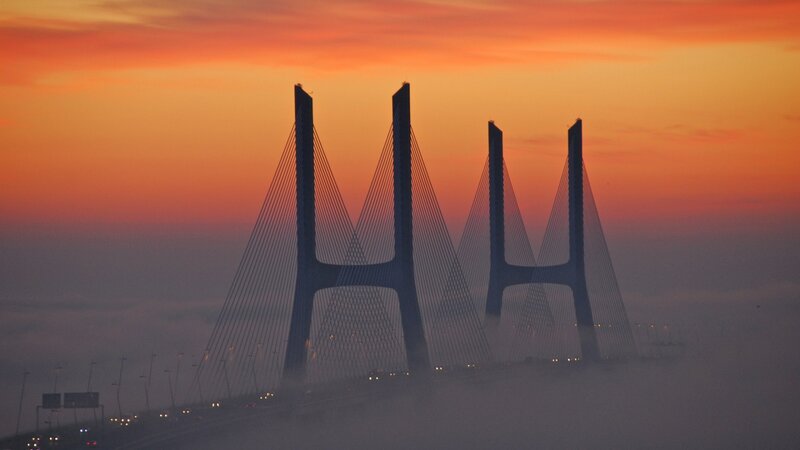 Suspension Bridge at Sunset — Orange, Dramatic, Photograph, Sky