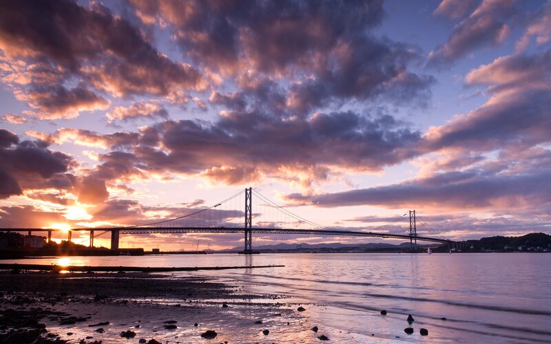 Suspension Bridge at Sunset — Purple, Dramatic, Photograph, Sun, Clouds