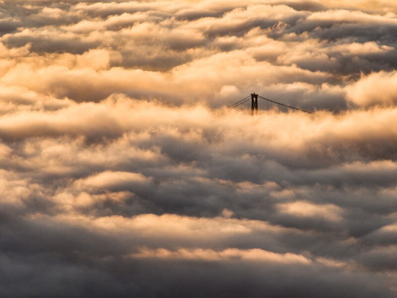 Suspension Bridge in Clouds