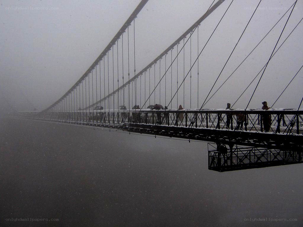 suspension bridge in fog