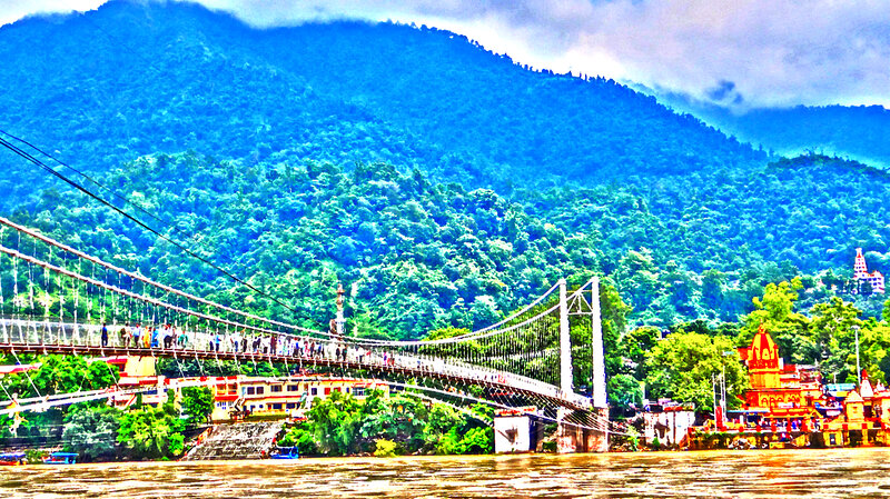 Suspension Bridge over River — Blue, Dramatic, Photograph