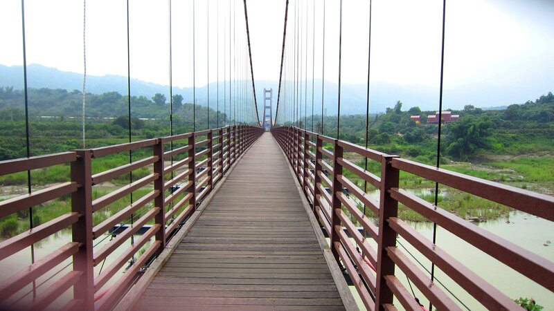 Suspension Bridge over River — Brown