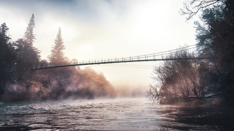 Suspension Bridge over River — Gray, Misty