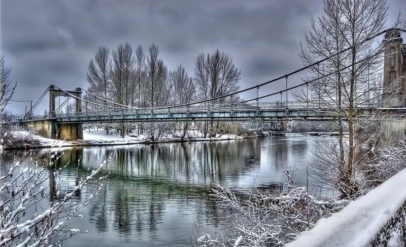Suspension Bridge over River — Gray