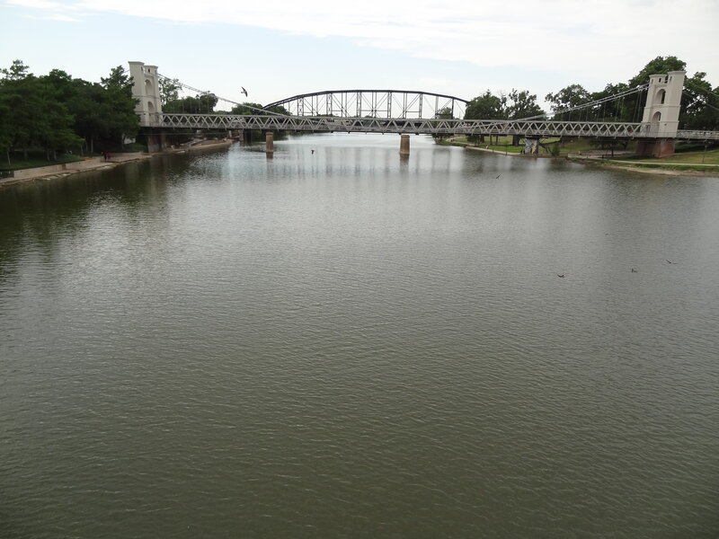 Suspension Bridge over River — Green, Calm, Afternoon