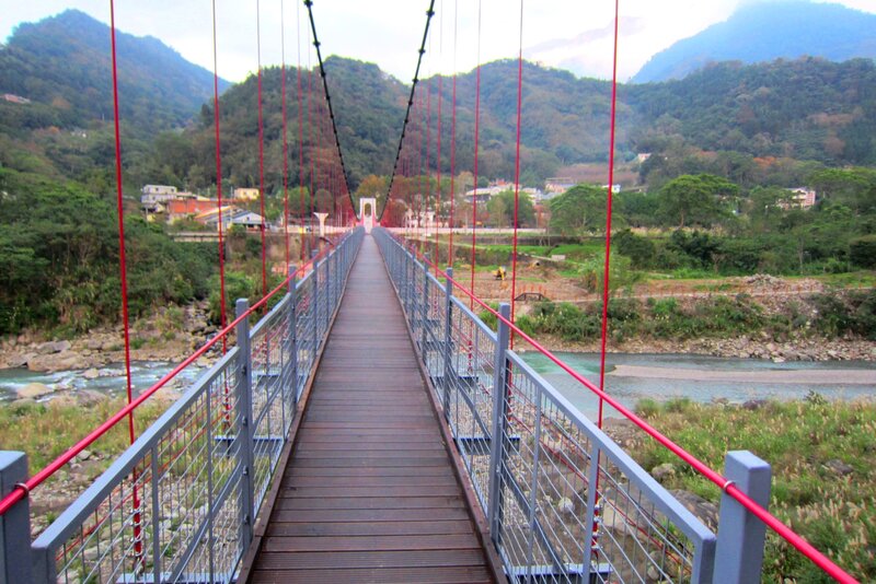Suspension Bridge over River — Green, Serene, Afternoon, Photograph, Mountains