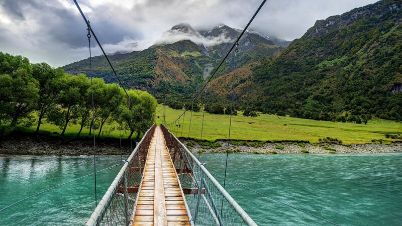 Suspension Bridge over River — Green, Serene, Afternoon, Photograph, Mountains, Trees