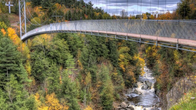 Suspension Bridge over River — Green, Serene, Autumn