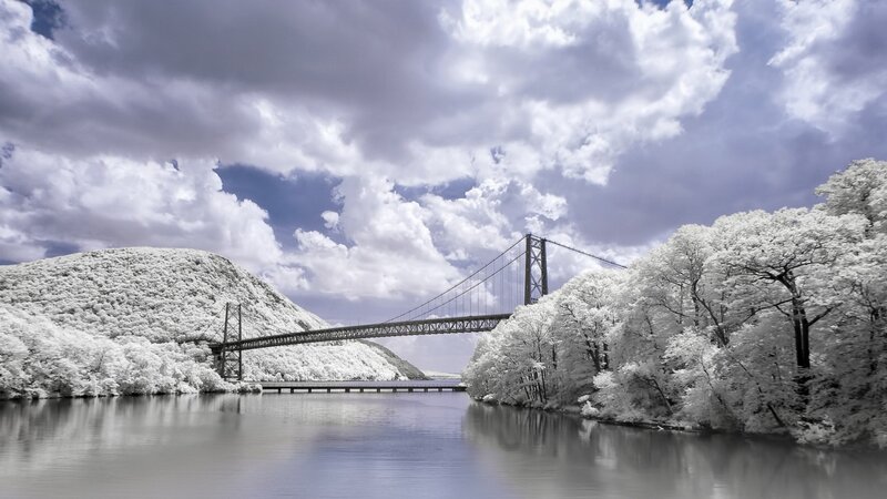 Suspension Bridge over River — White, Dramatic