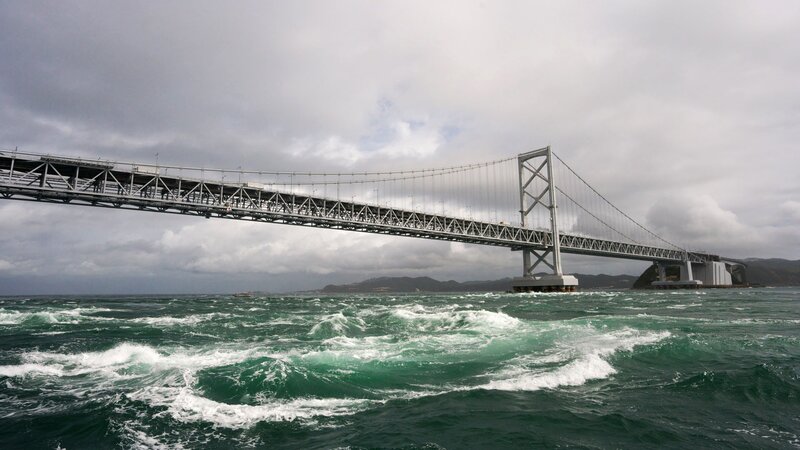 suspension bridge over turbulent sea