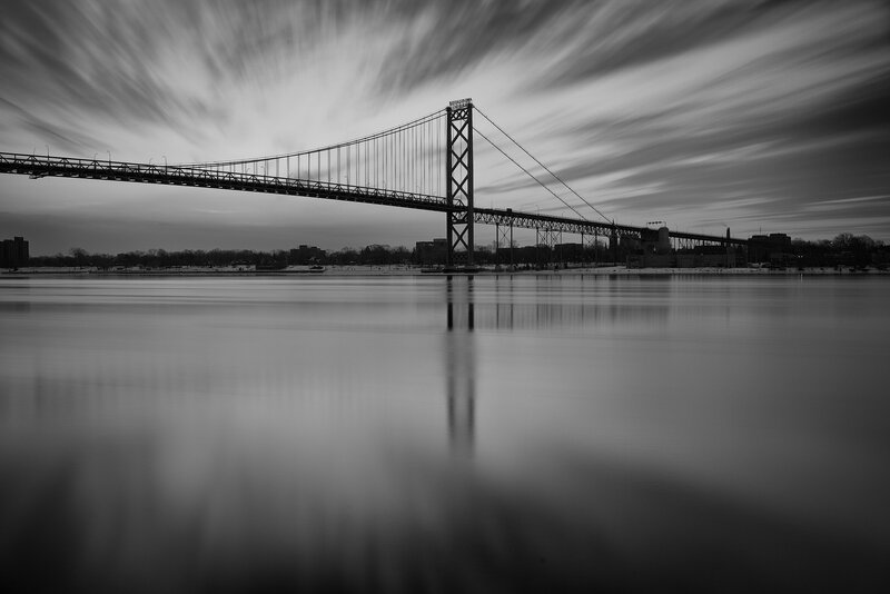 Suspension Bridge over Water — Black, Dramatic