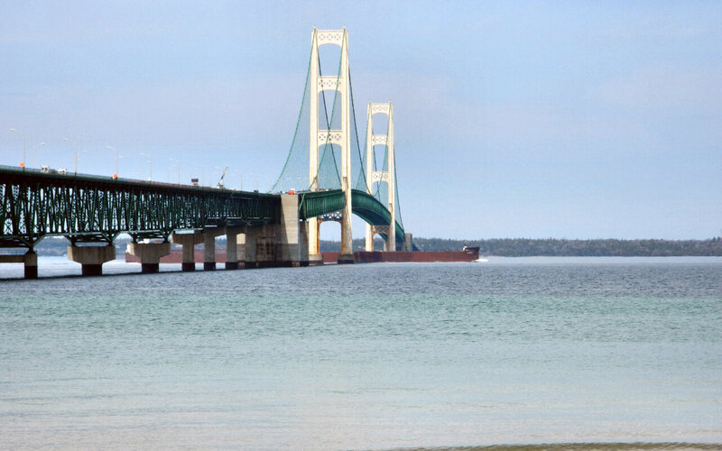 Suspension Bridge over Water — Blue, Calm, Afternoon